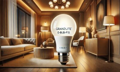 A sleek Grandlite E-BUB-F15 bulb emitting a soft glow, mounted in a modern lighting fixture within a stylish room.